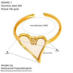 Detail of 18k gold plated heart ring with white shell inlay and 17mm inner diameter