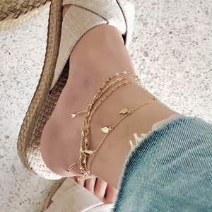 Minimalist 925 sterling silver multilayer leaf anklet on female ankle with sandals