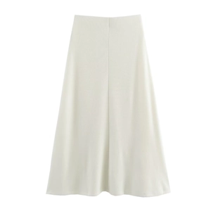 Detail of white midi skirt featuring a soft knitted fabric and a centered vertical seam