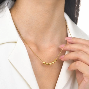 Minimalist gold stainless steel snake chain necklace with five oval bead pendants
