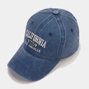 Detail of vintage navy blue washed denim baseball cap with California embroidery