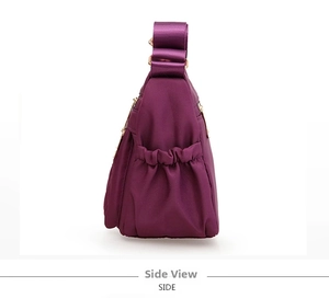 Side view of large purple oxford cloth tote bag showing elastic side pocket for bottles