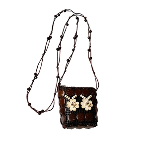 Handmade coconut shell flower crossbody bag with bohemian woven beads and brown strap