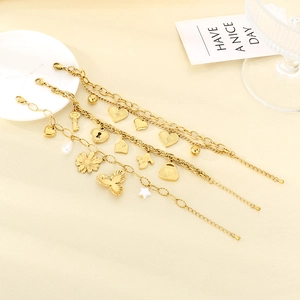 Golden heart and key pendant charm bracelets with pearls and bead chains set