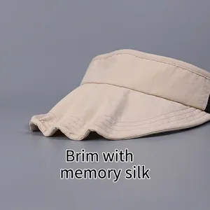 Beige foldable athletic sun visor with shapeable memory wire brim for outdoors