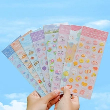 Close-up of colorful gold-stamped alphabet and cartoon stickers for DIY journals
