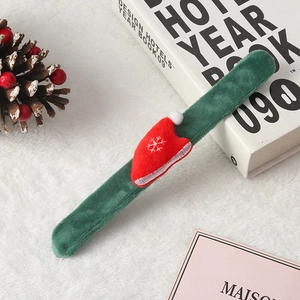 Green plush Christmas slap bracelet featuring a red Santa hat with snowflake embroidery