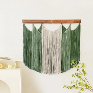 Bohemian woven macrame wall hanging with dark green tassels and solid wood beam