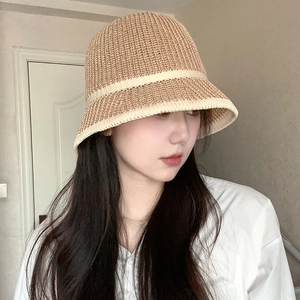 Brown knit bucket hat for women featuring a white decorative band and scallop edge