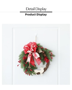Detail display of Christmas wreath with red berries, pine cones, and reindeer bow on a door