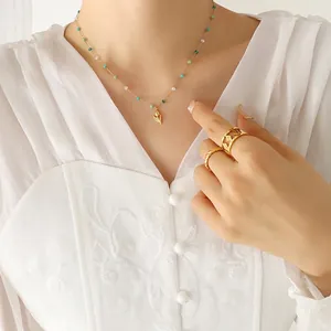 Chic gold tulip pendant necklace and beaded jewelry set worn by a fashion model