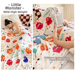 Cozy flannel blanket with colorful cartoon monsters for sleeping and home reading comfort