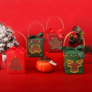 Christmas gift boxes with festive ribbons and a persimmon ceramic jar on a red background