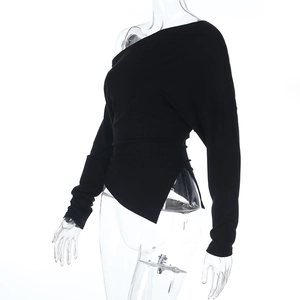 Side view of black long sleeve top featuring asymmetrical neckline on transparent mannequin