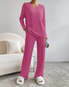 Close-up of rose red knit loungewear set with ribbed texture and loose V-neck top
