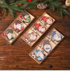 Detailed view of wooden Christmas gnome ornaments with hanging beads on a rustic table