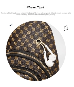 Detail view of brown patterned crossbody bag showing gold zippers and earphone jack