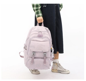 Detailed shot of a purple school backpack with bear prints and functional buckles