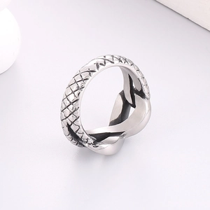 Macro shot of silver titanium steel ring with creative dragon scale texture and polished finish