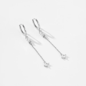 Detail of silver long chain earrings with marquise and square cut white zircons