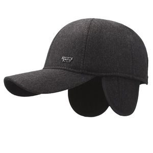 Winter men's dark grey baseball cap with ear flaps and sports style metal badge