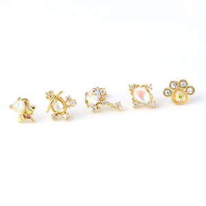 Set of five gold stainless steel earrings with iridescent aurora crystals and unique charms