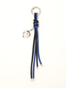 Detailed view of woven leather keychains with silver heart charms in black and blue