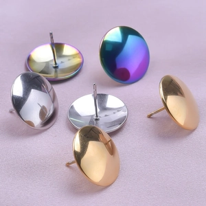 Macro view of polished stainless steel stud earrings in silver, gold, and rainbow finishes