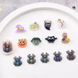 Colorful Halloween 3D nail art charms featuring pumpkins, spiders and wizard hats