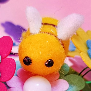 Handmade wool felt honey bee ornament with pearl detail for DIY crafts and accessories