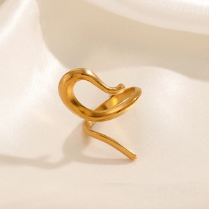 Minimalist gold spiral open ring featuring a smooth geometric hollow design on silk background