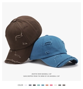 Detail of distressed vintage baseball caps showing heavy canvas texture and frayed edges