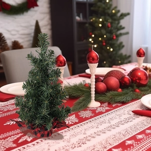 Miniature green Christmas tree with red plaid base for festive tabletop decoration