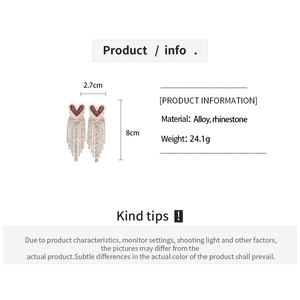 Detail showing dimensions of red heart fringe earrings with sparkling white rhinestones