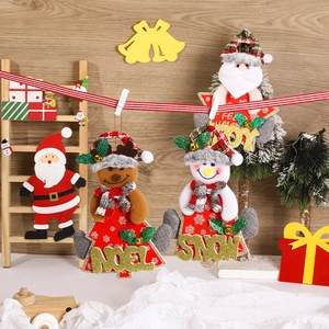 Plush Christmas tree ornaments set with Santa, Snowman and Gingerbread figures on wood