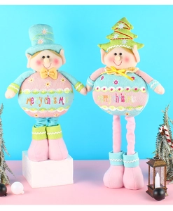 Detail of Christmas elf dolls with telescopic legs and Merry Christmas embroidery