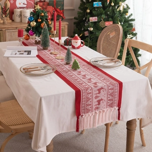 Christmas red jacquard table runner with white reindeer and snowflake patterns and tassels