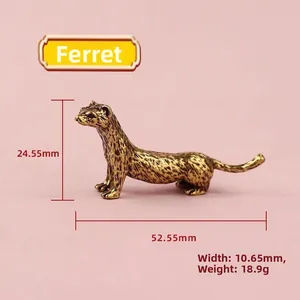 Macro shot of a solid brass weasel statue with detailed fur texture and metallic finish
