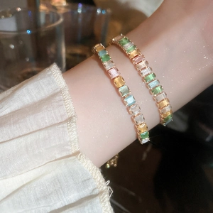 Elegant gold bracelet featuring rectangular colorful zircons in vibrant candy colors