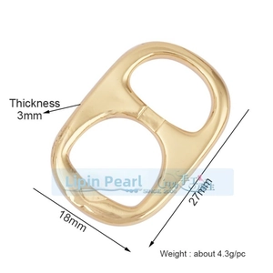 Macro view of gold metal clover pull-tab connector charms with 3mm thickness for DIY jewelry