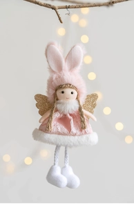 Detailed view of plush angel girl doll with pink hat and golden glitter wings ornament
