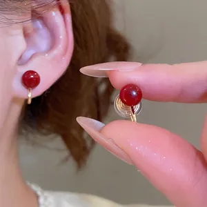 Elegant red pearl ear clips with gold finish for non-pierced ears in French style