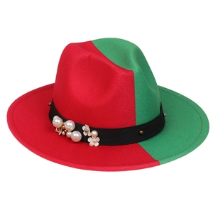 Close-up of the red and green wool felt hat featuring pearl and floral ribbon details
