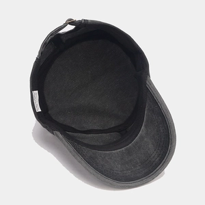 Detail of the inner black sweatband and metal buckle on this washed cotton army cap