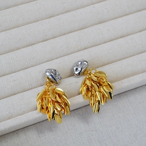Two-tone gold and silver leaf tassel earrings with irregular metallic top design