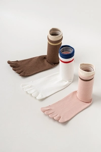 Detailed view of three pairs of breathable cotton five-toe socks in brown and striped patterns