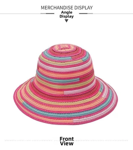 Detail of colorful striped sun hat with vibrant straw weaving and wide brim design