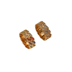 Bohemian gold Cuban chain rings with multicolored zircons and crystals on white background
