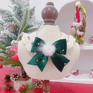 Festive Christmas pet collar with green velvet bow, gold stars, and lace knitting