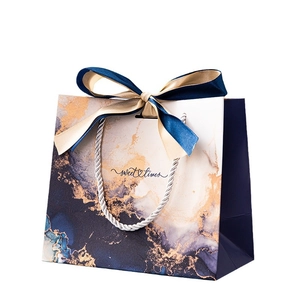 Blue marble gift bag with sweet times text, gold accents and silk ribbon handle